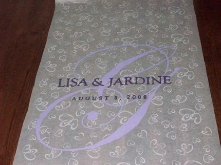 I discovered these instructions for creating a monogrammed aisle runner on 